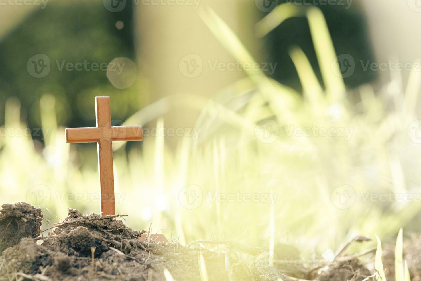 Cross on blurry sunset background. photo