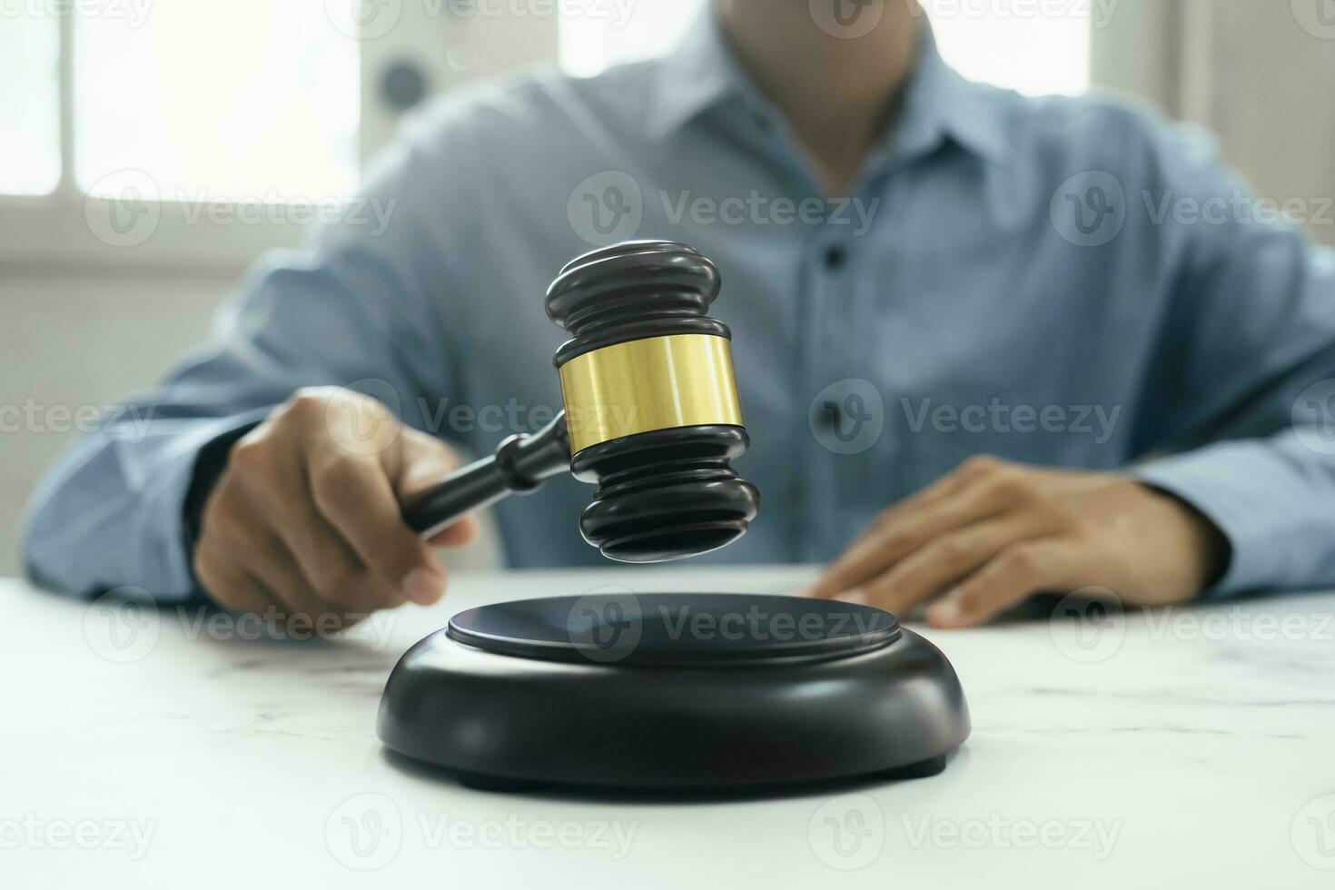 Male lawyer in the office with brass scale. photo