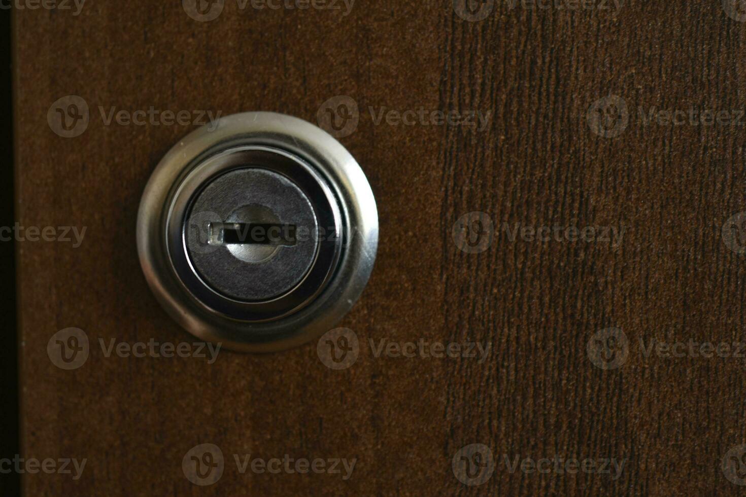 Keyhole close-up. The lock on the door. photo