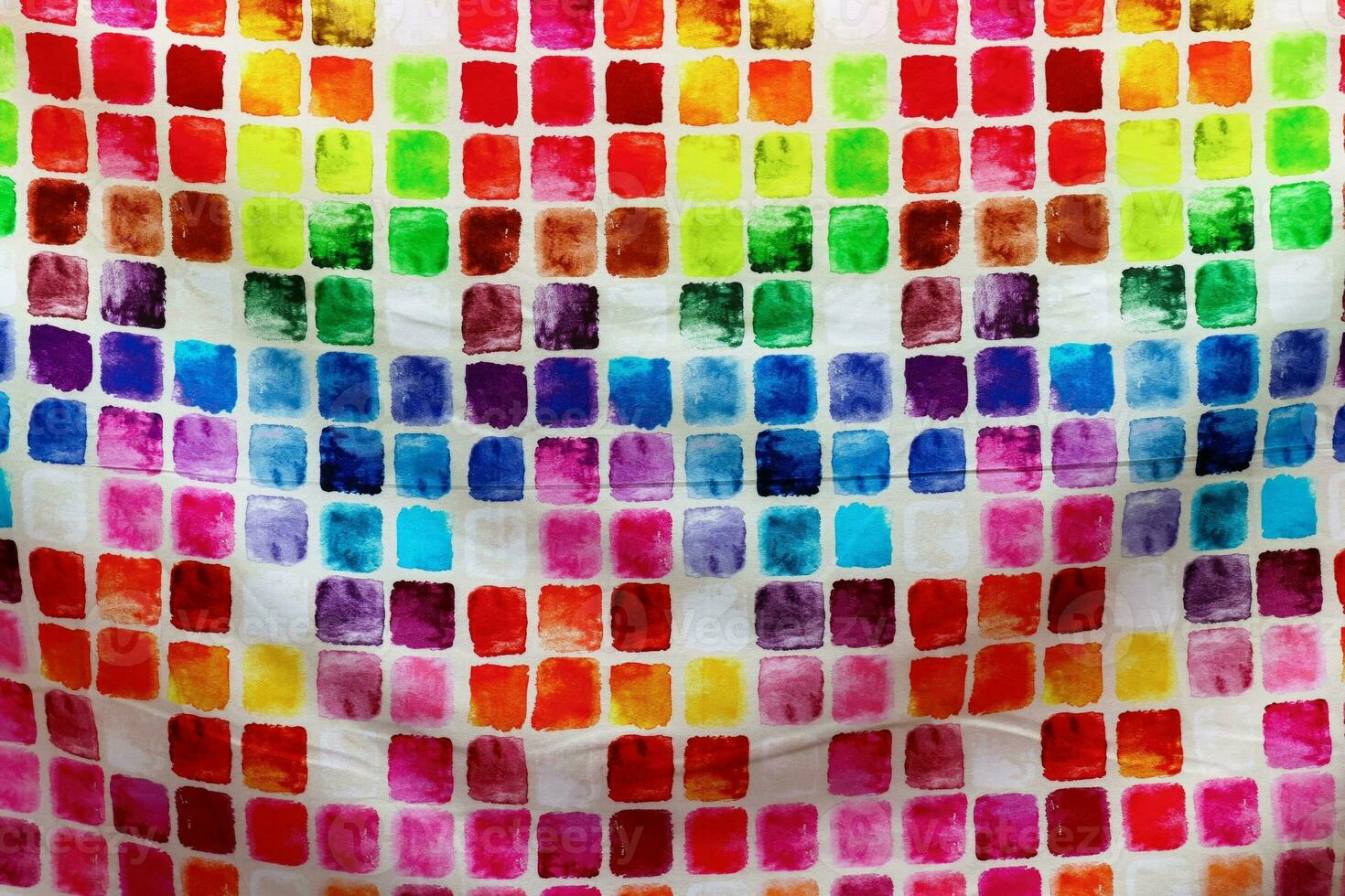 Detailed close up view on samples of cloth and fabrics in different colors found at a fabrics market photo