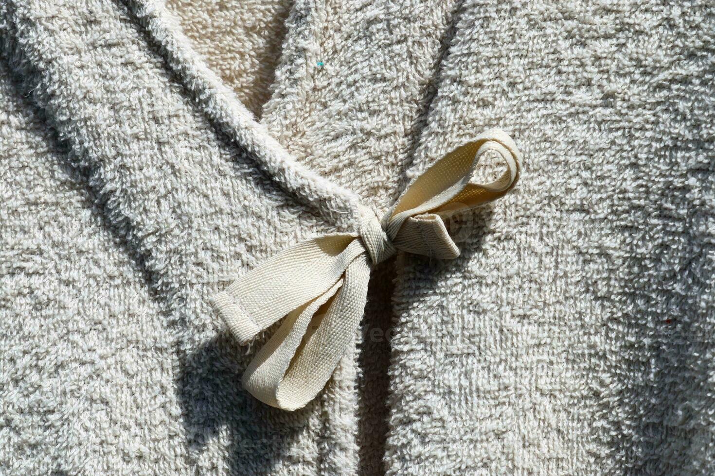 Detailed close up view on samples of cloth and fabrics in different colors found at a fabrics market photo