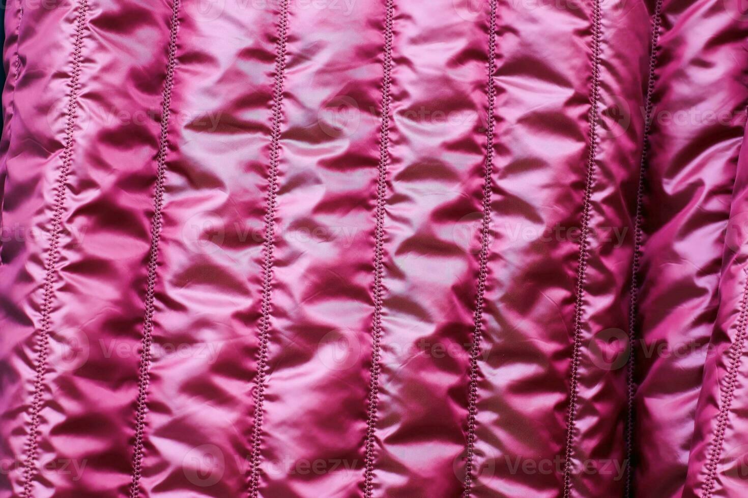 Detailed close up view on samples of cloth and fabrics in different colors found at a fabrics market photo