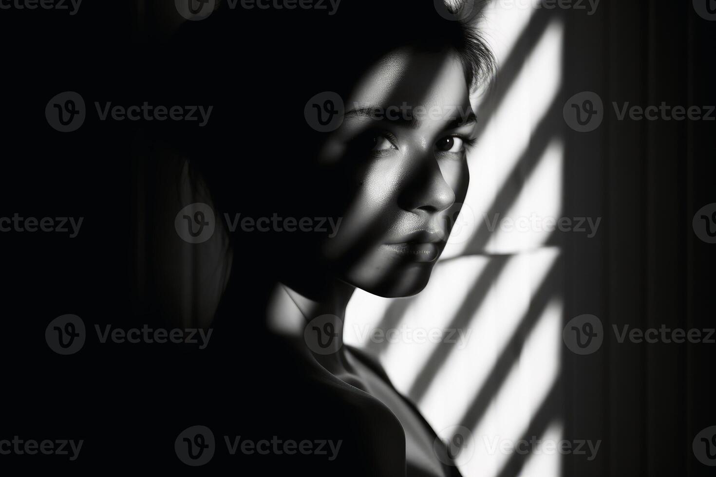 A Woman in light and shadow in black and white created with technology. photo