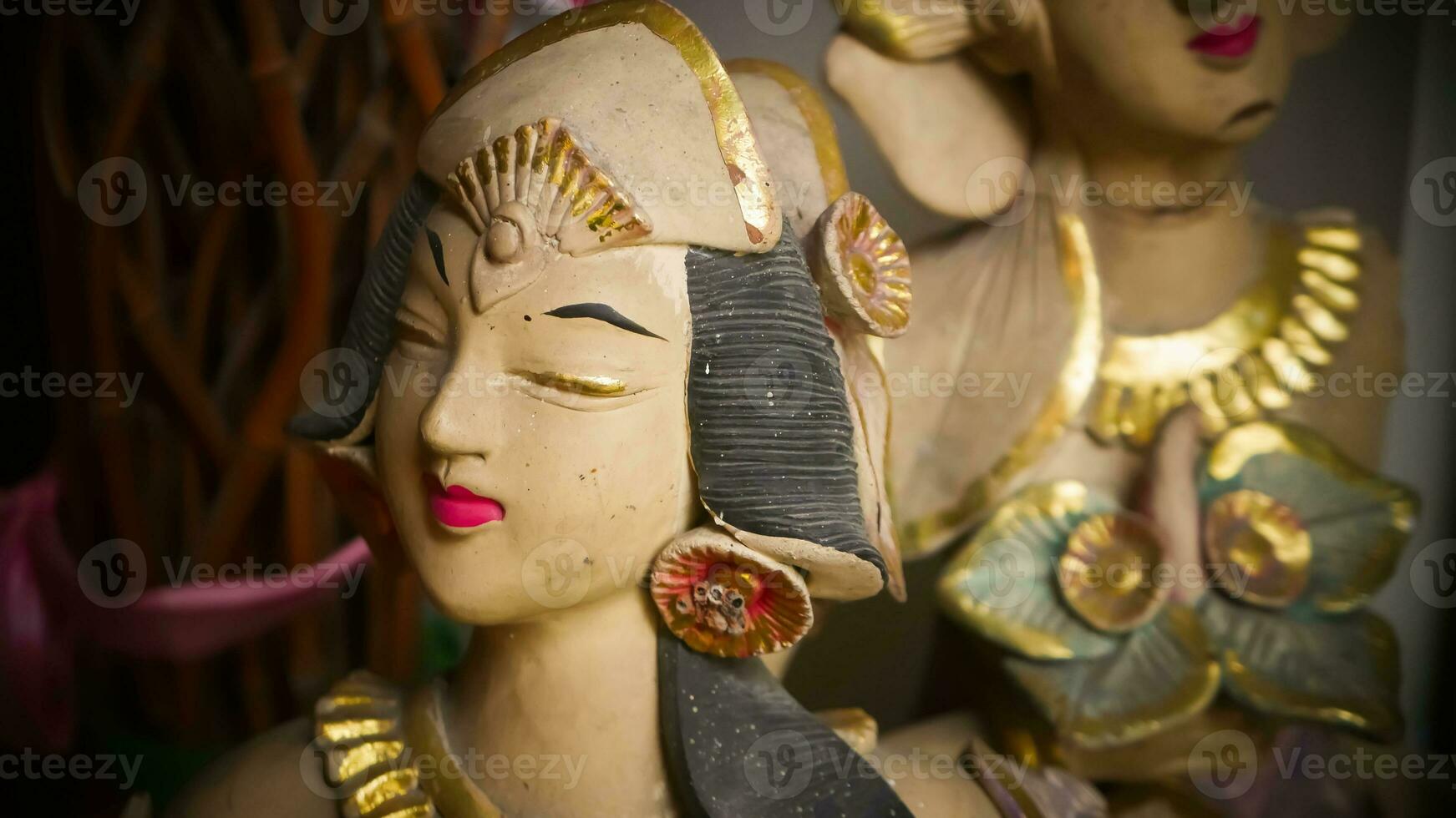 Beautiful artistic statue of a Balinese or javanese dancer used as garden decoration, javanese gnome indonesia photo