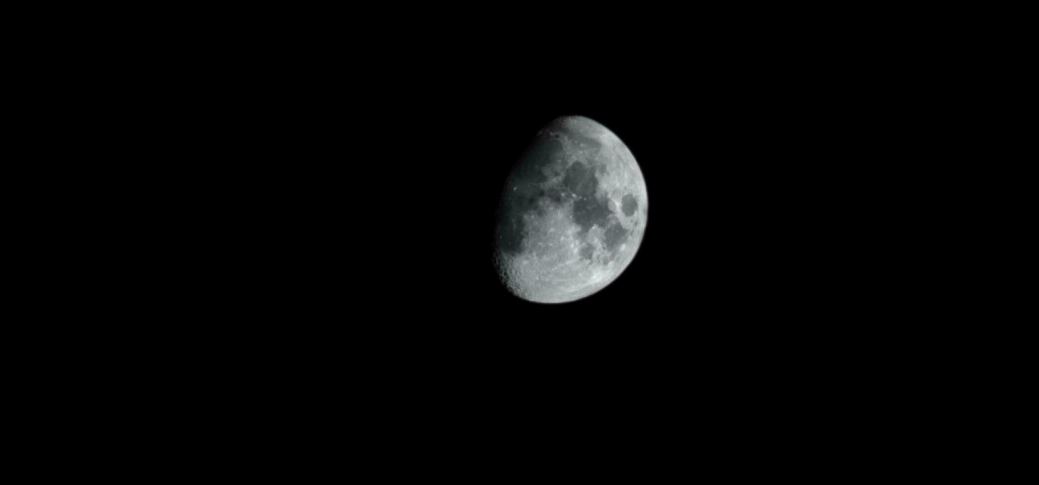 Quarter moon in the night sky photo