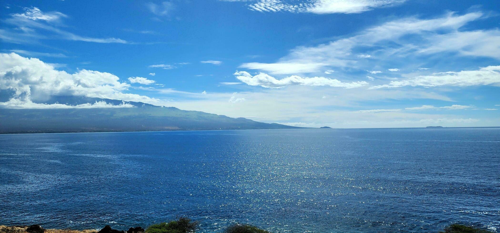 Hawaii coastline with blue ski and clouds on a summer day photo