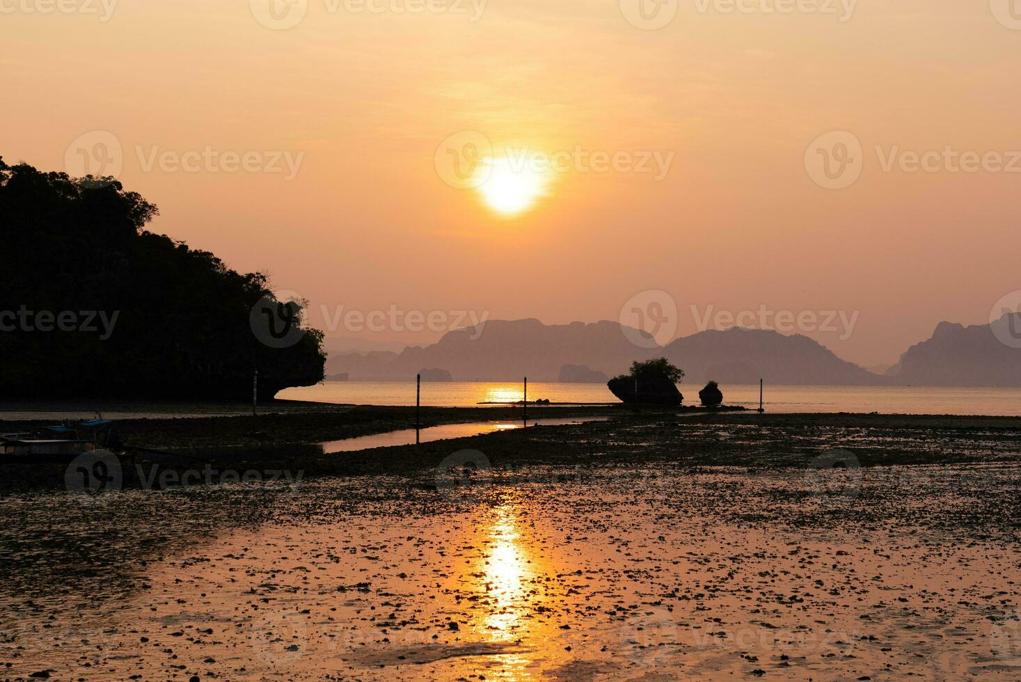 Lanscape of Beach and Sea and Golden Sky at Sunrise photo