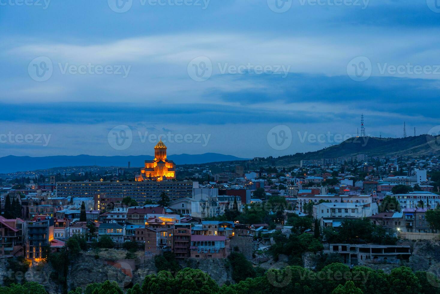 Holy Trinity Cathedral of Tbilisi and Cityscape of Georgia at Twilight photo