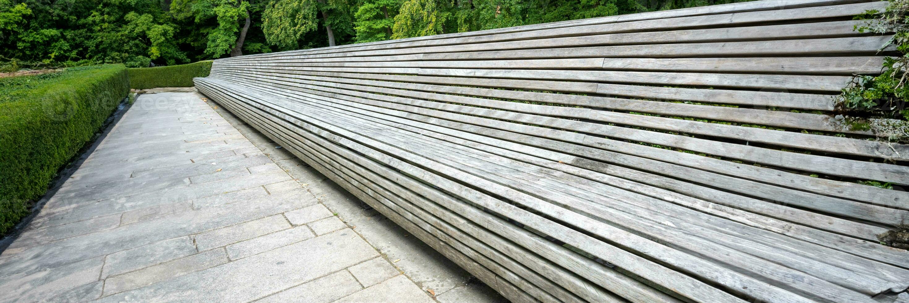 panoramic view of endless bench from wooden slats photo