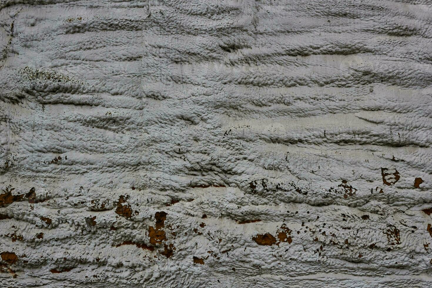 resumen blanco antecedentes con rojizo áspero superficie. foto