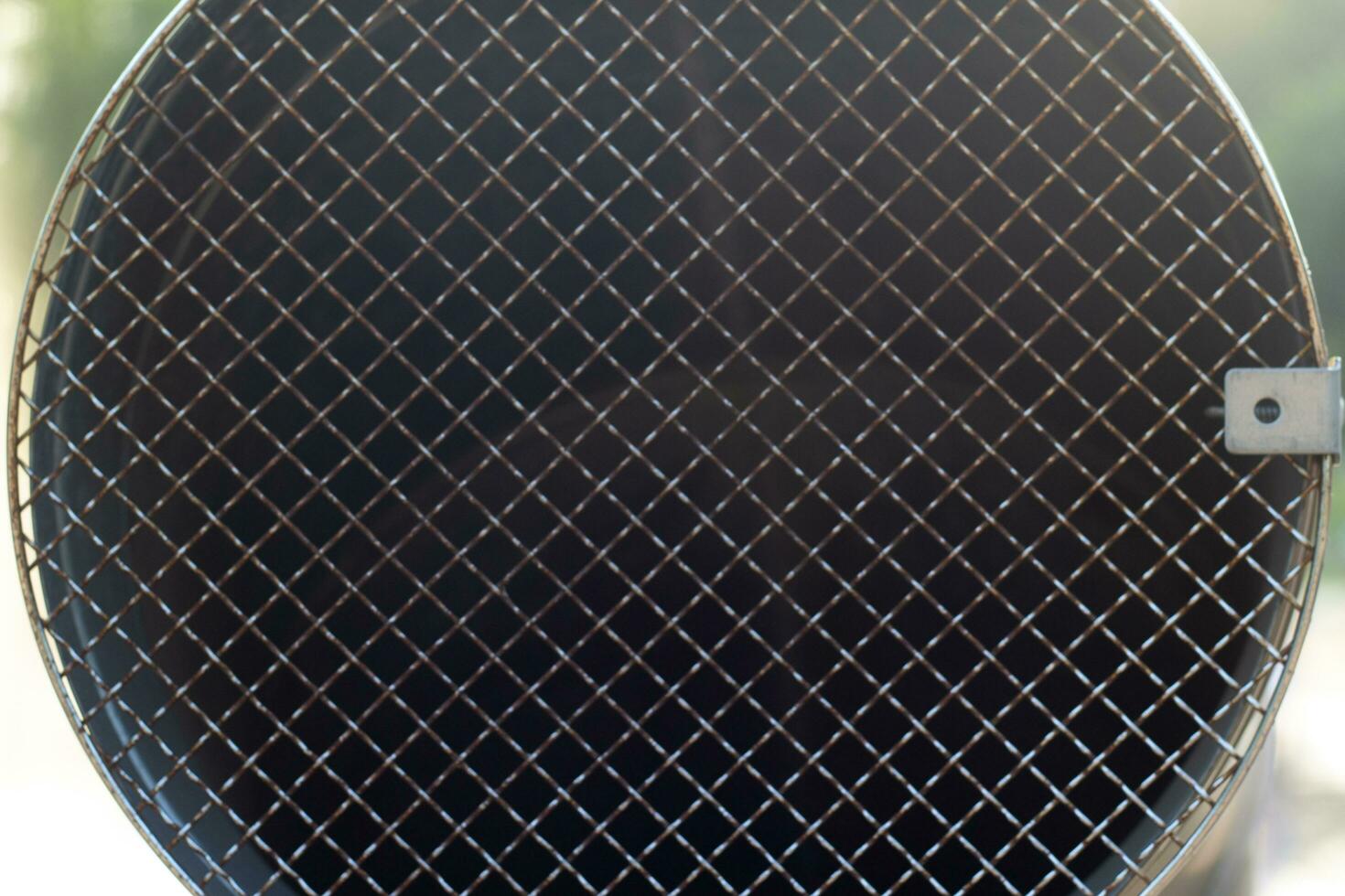 Metal pipe with a shallow grating close-up. photo