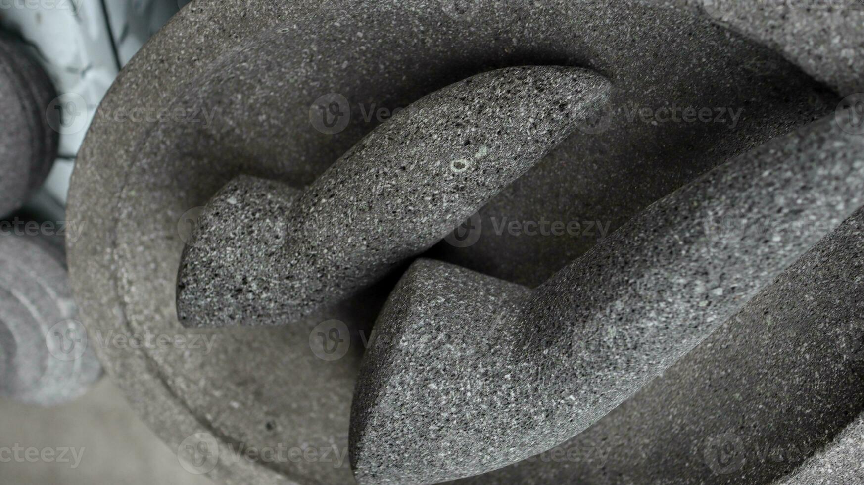 Traditional kitchenware named stone mortar and pestle photo