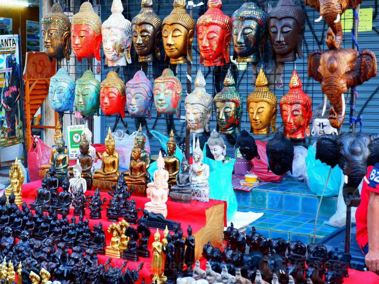 Buddha statues and masks photo