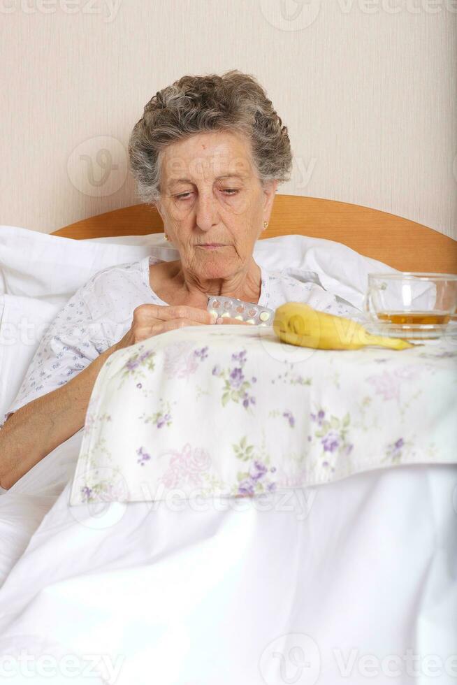 Senior woman takes some prescription photo