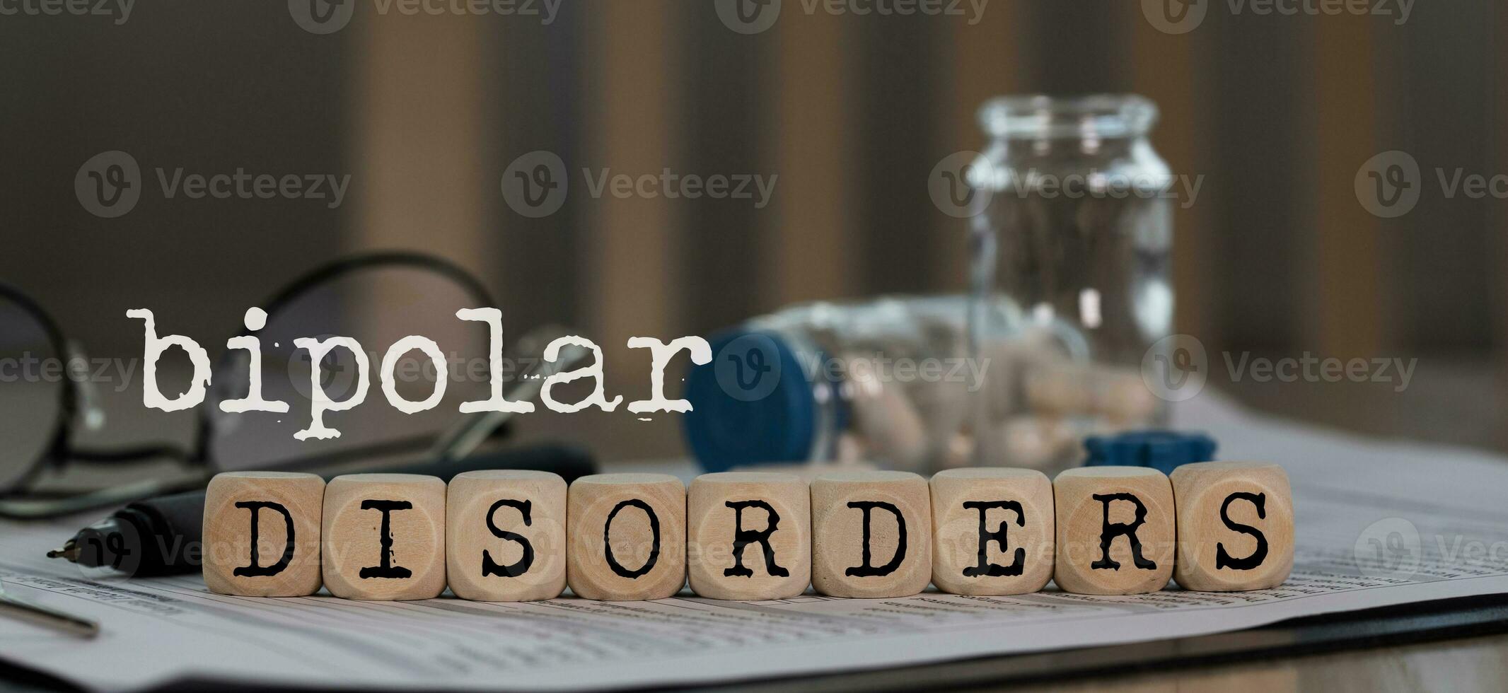 Words BIPOLAR DISORDERS composed of wooden dices. photo