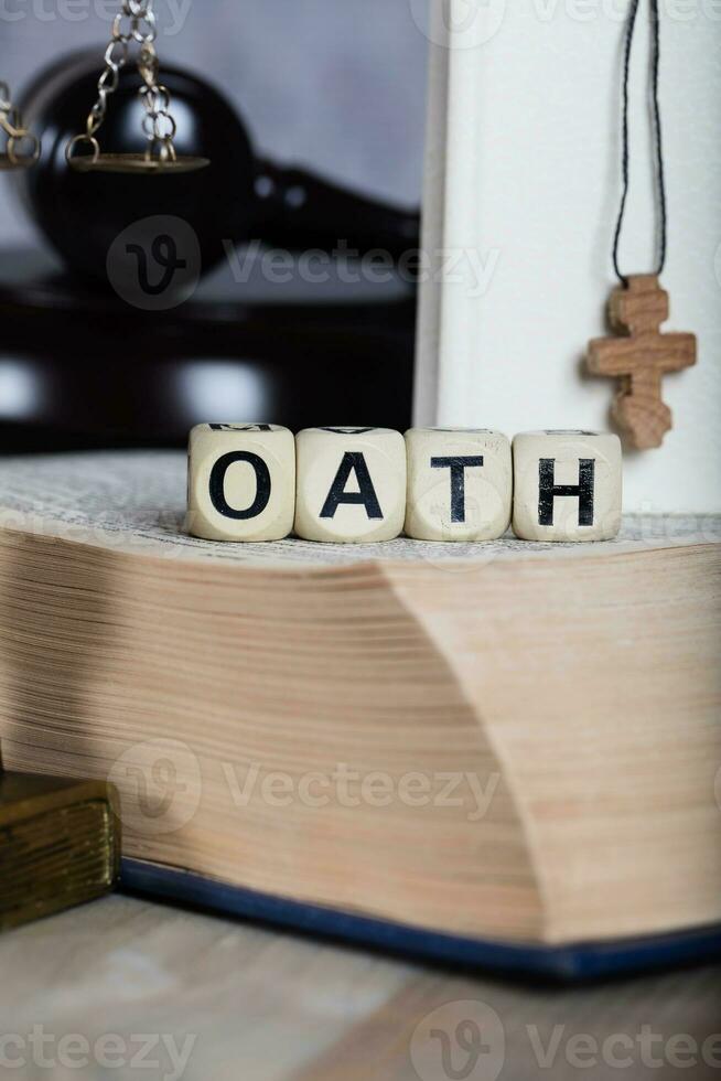 Word OATH composed of wooden letters. photo