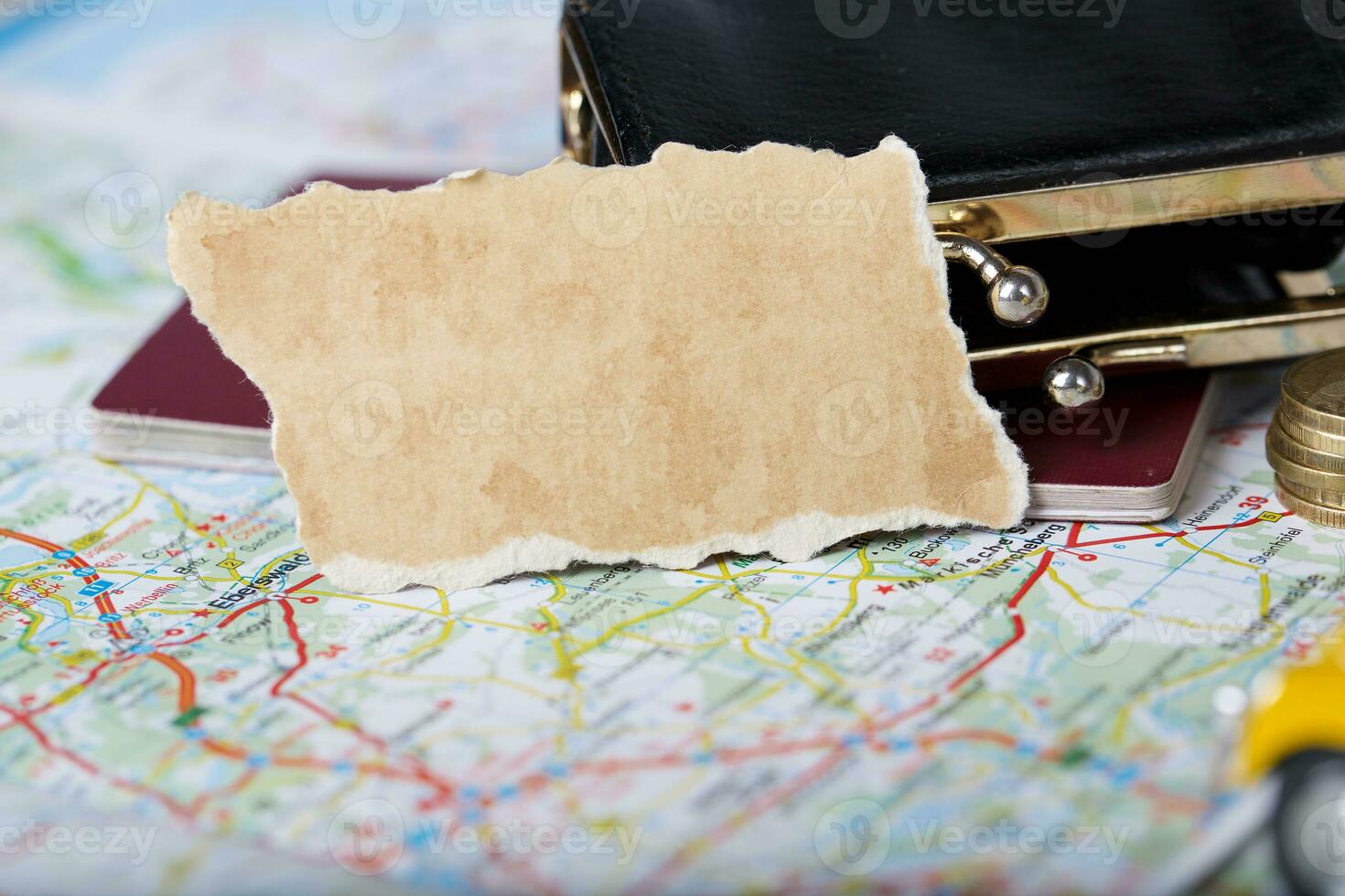 Wallet, coins, pass on a map. photo