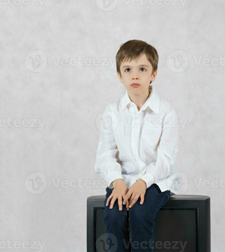 Boy and an old TV. Free space for a text. photo