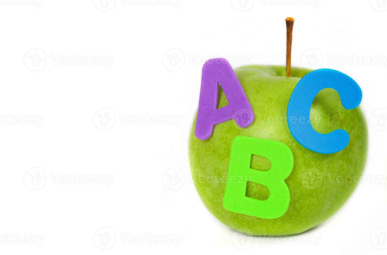 Apple and A,B,C letters attached to it. Closeup photo