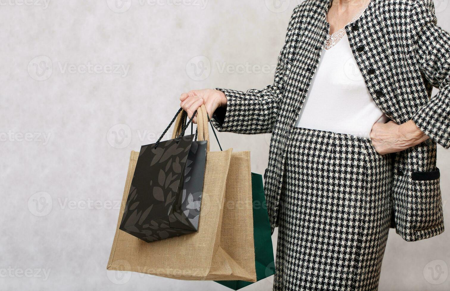 Old woman with shopping bags photo