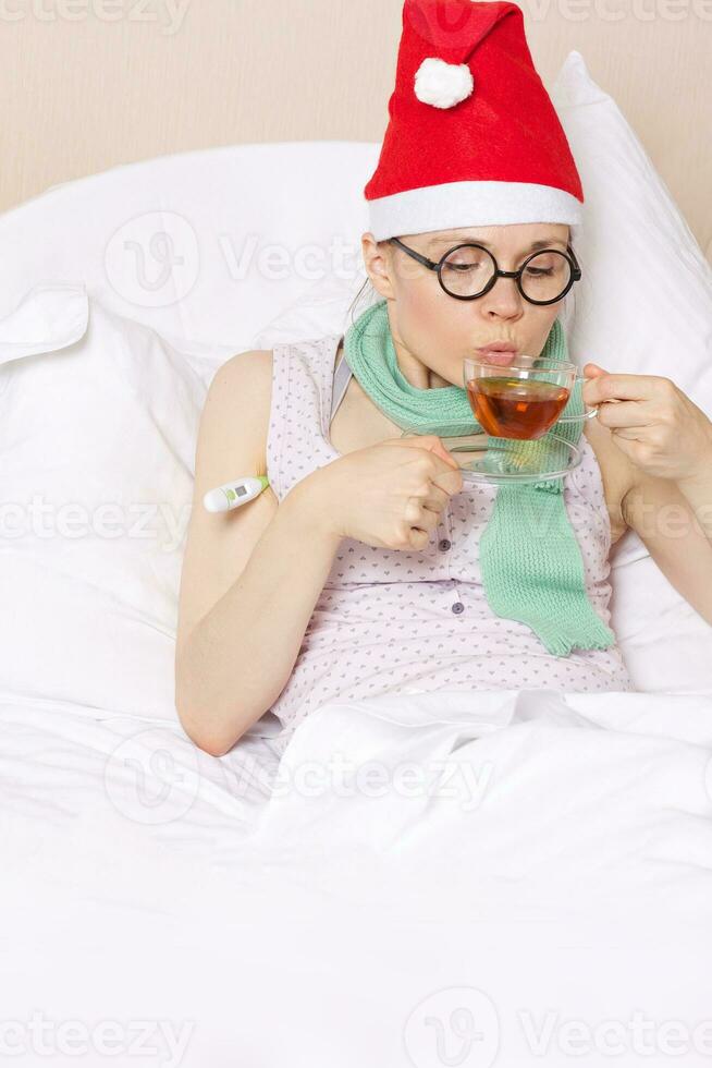 Sick young lady in her bed photo