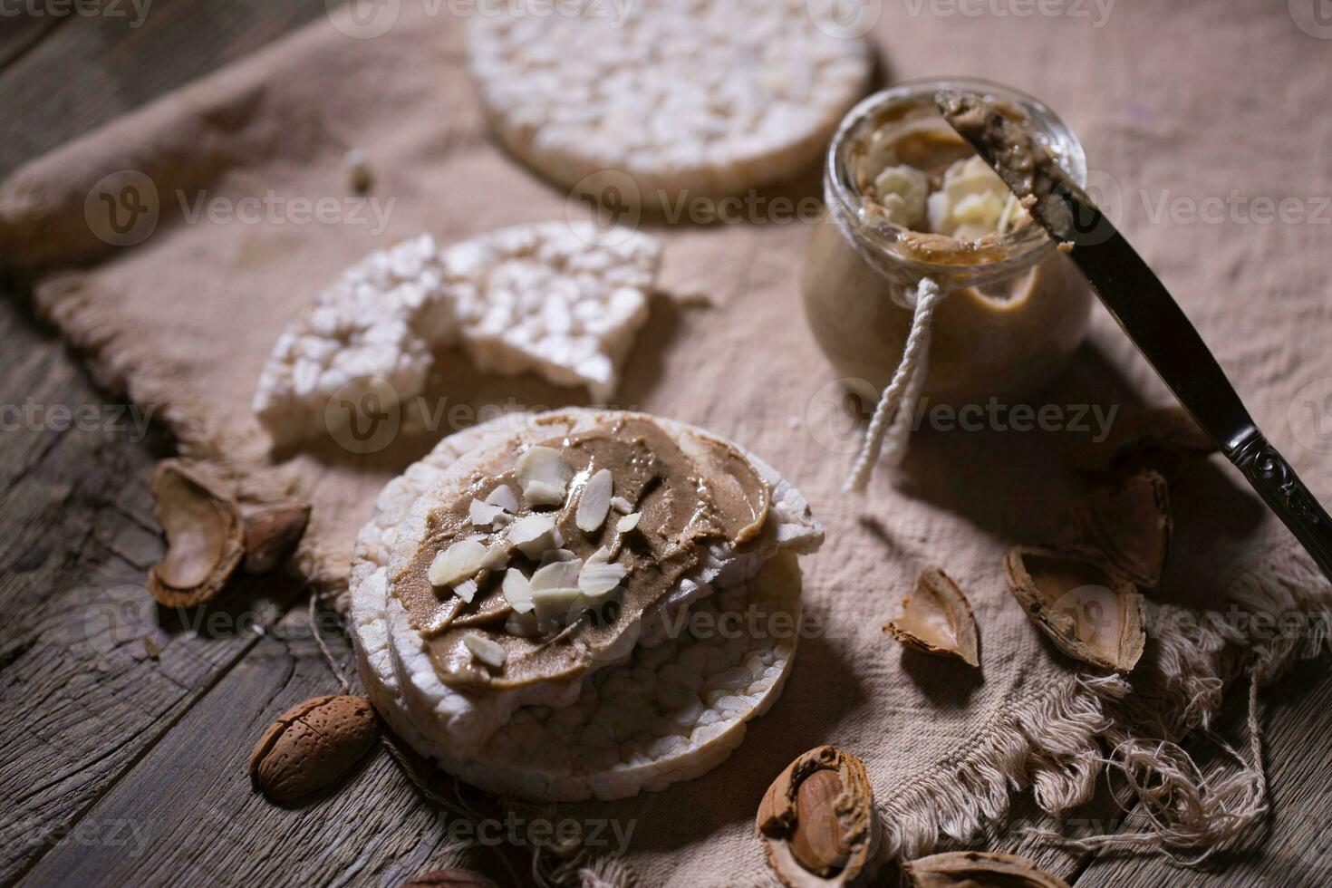 Homemade almond butter on a slice of rice crispbread. photo