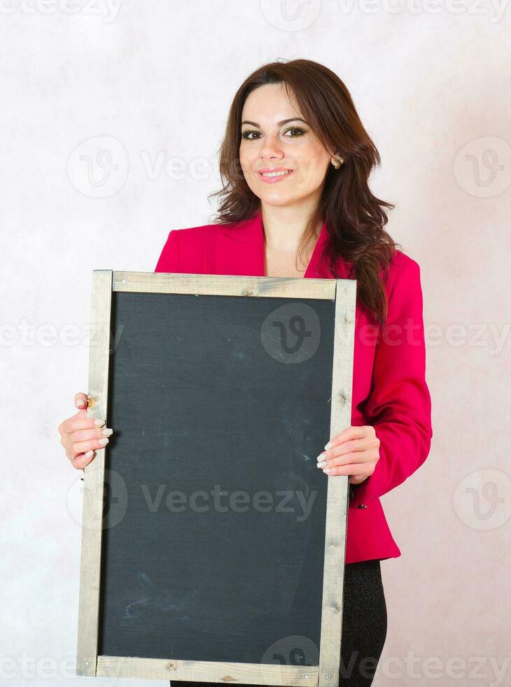 Young woman with a black chalk board photo