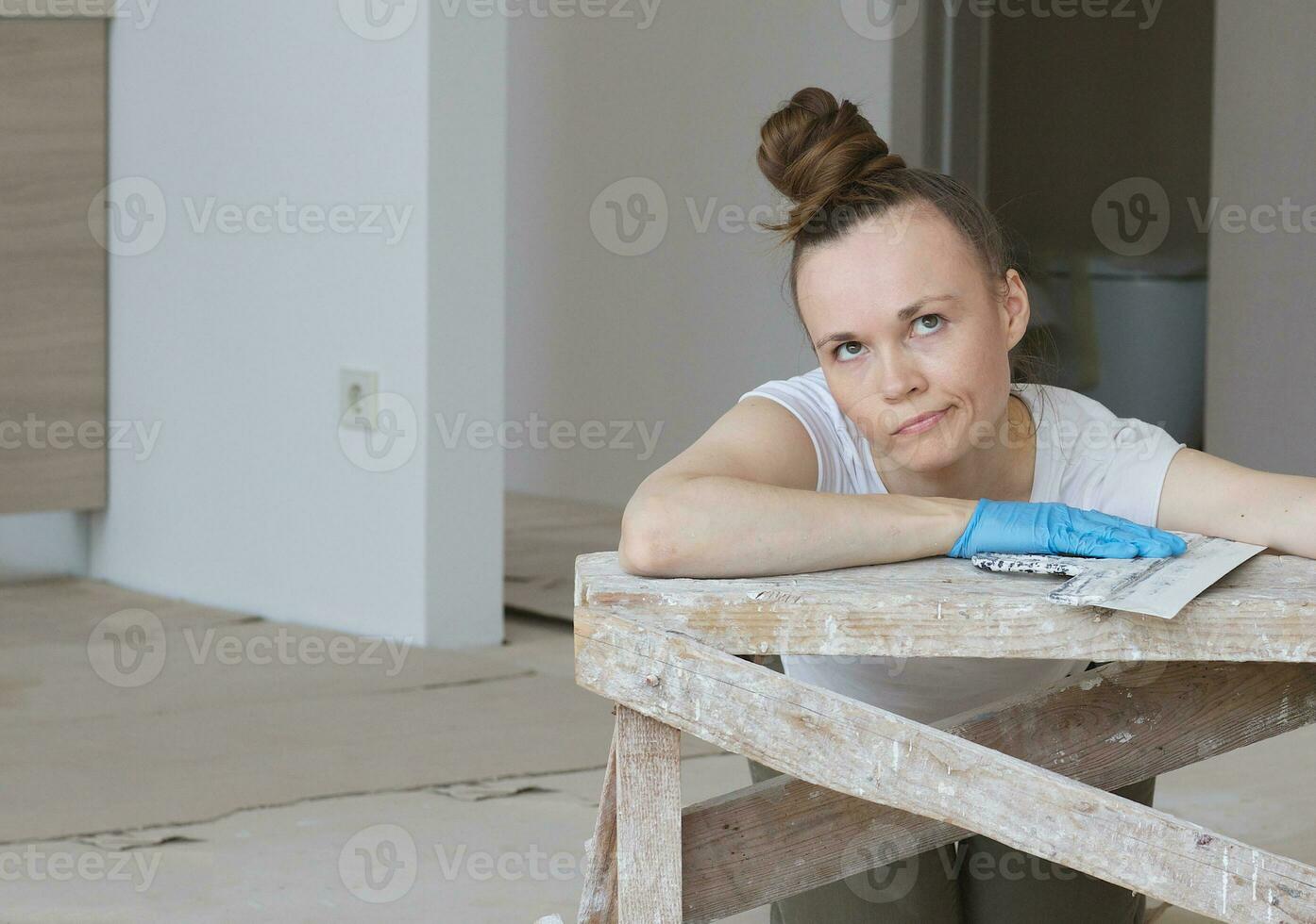 Young lady renovates  apartment photo