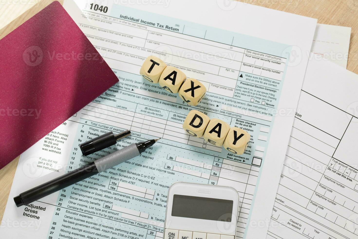 Word Tax Day composed of wooden letters. Closeup photo