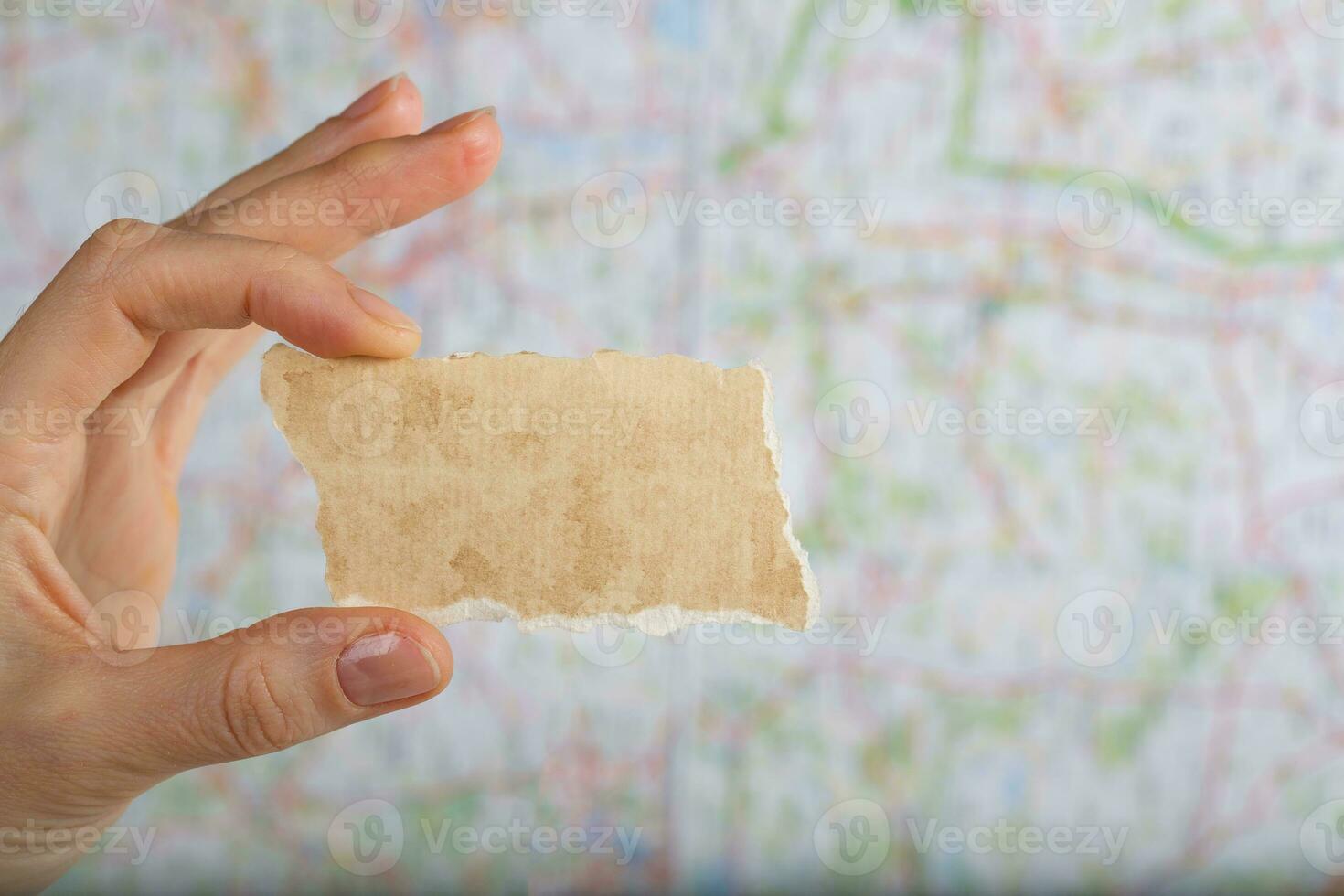 Piece of paper with free space for a text on a map. photo