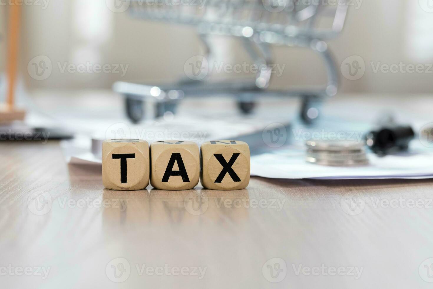Word TAX composed of wooden letters. Closeup photo
