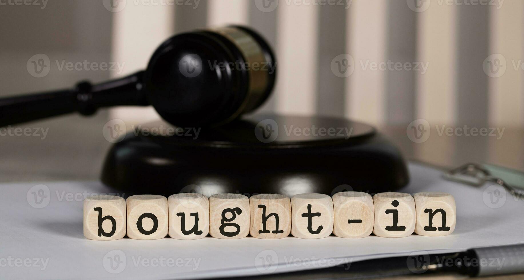 Term BOUGHT-IN  composed of wooden dices. photo