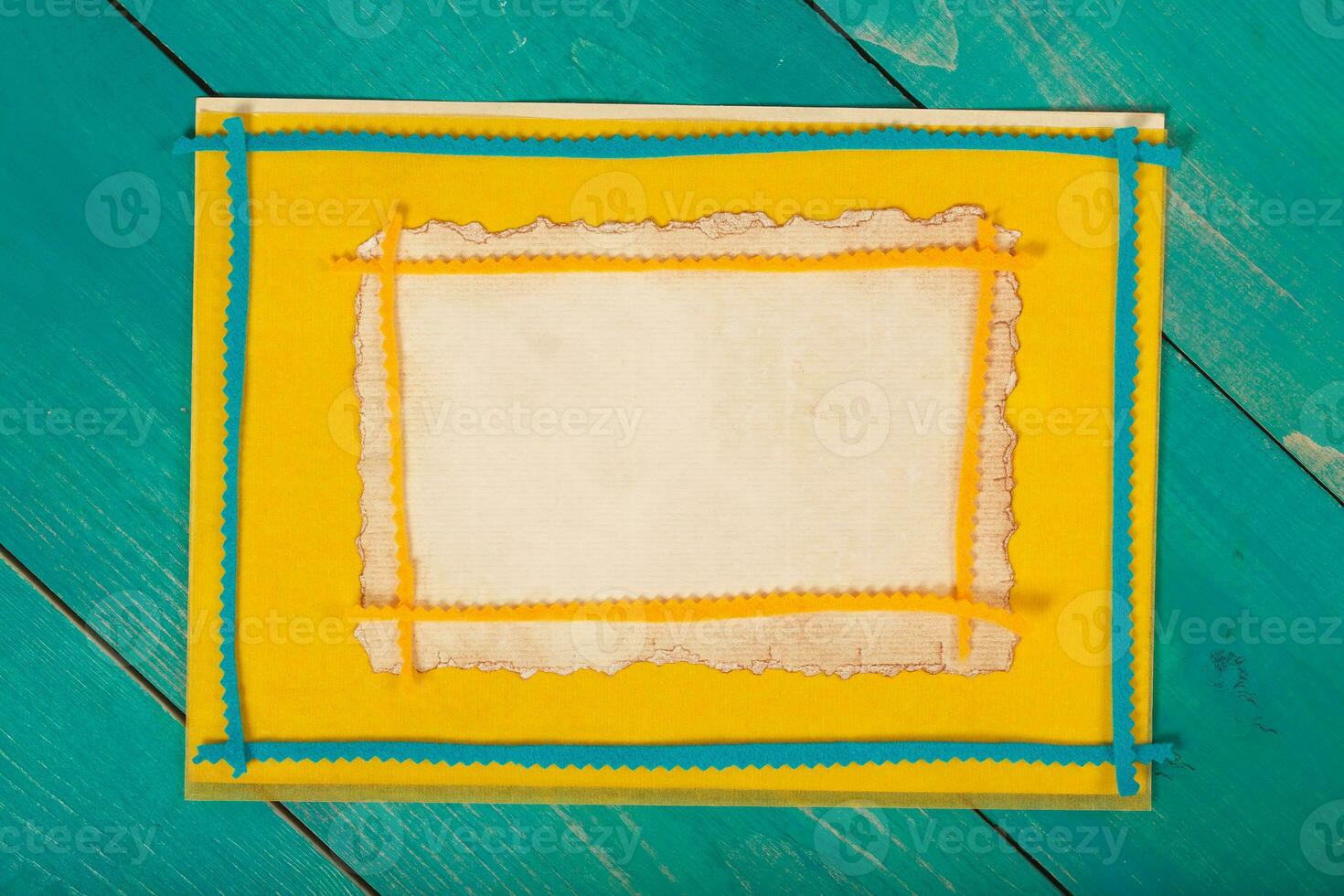 Yellow felt fabric on a wooden surface.Top view photo