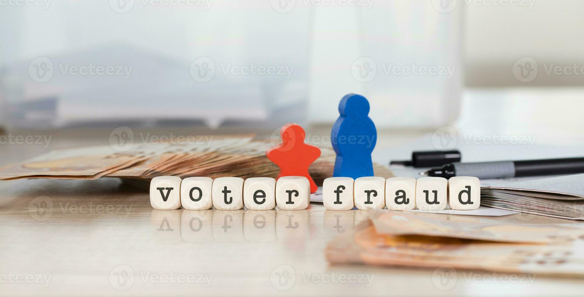 Word VOTER FRAUD composed of wooden letters. photo