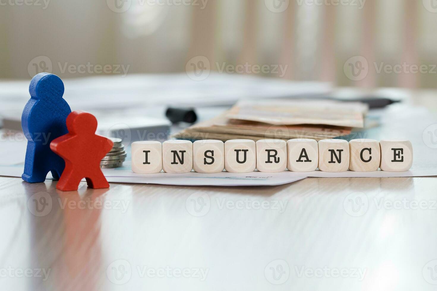 Word INSURANCE composed of wooden letters. photo