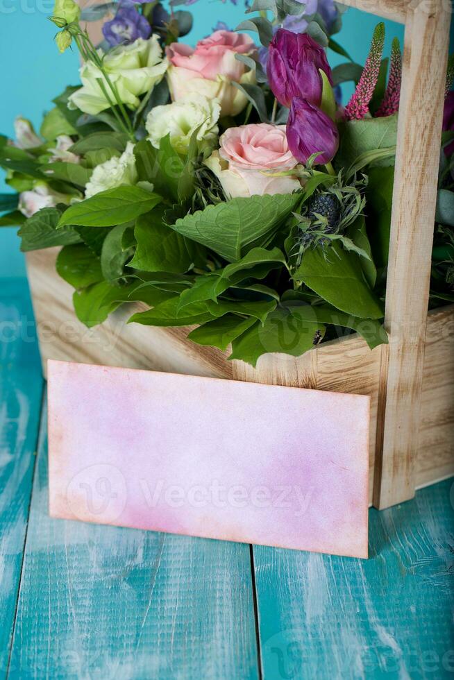 Woodenmade basket with beautiful flowers. photo