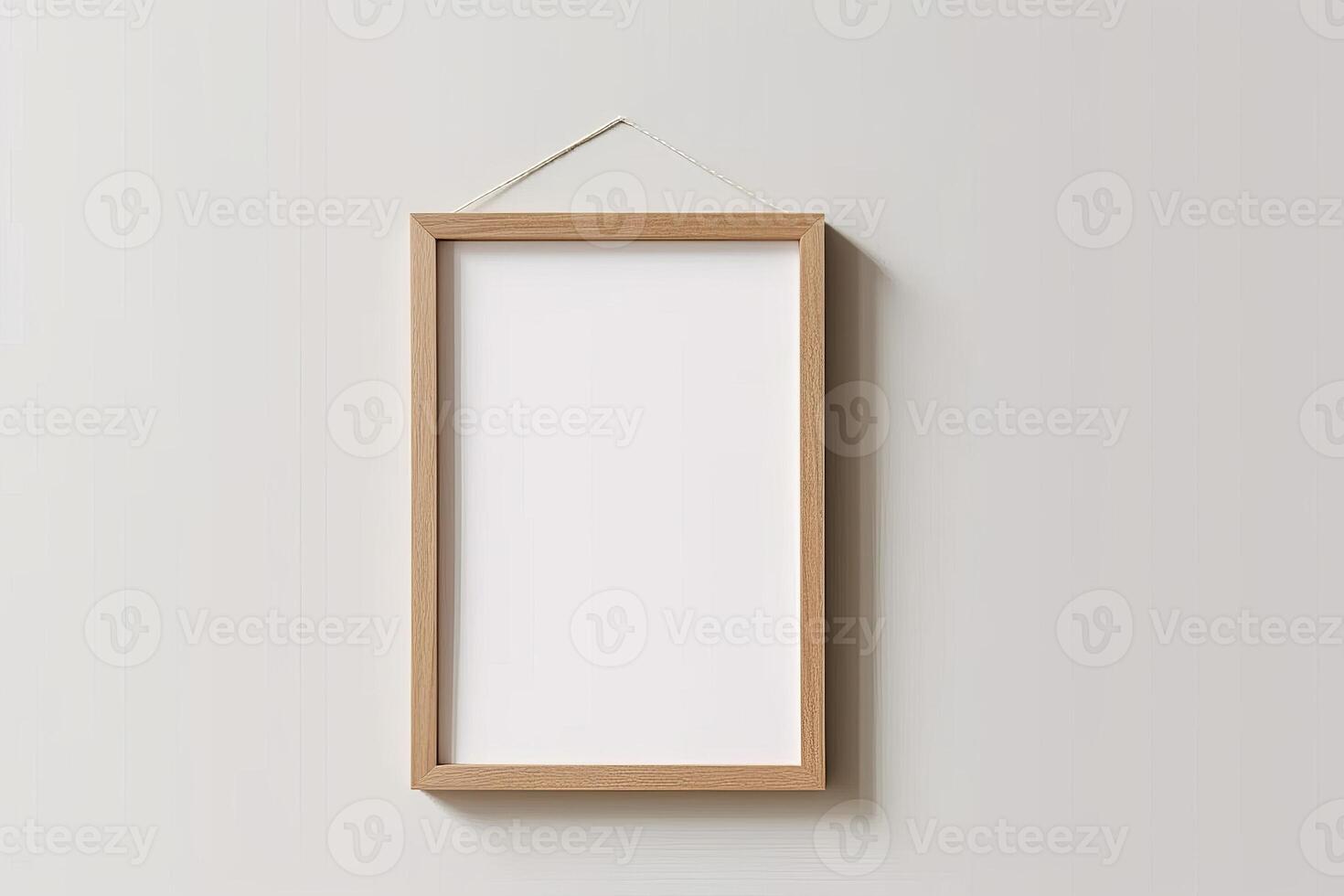Blank Wooden Picture Frame Mockup Hanging on Wall Empty Poster Mockup for Art Display. Front View with Copy Space photo
