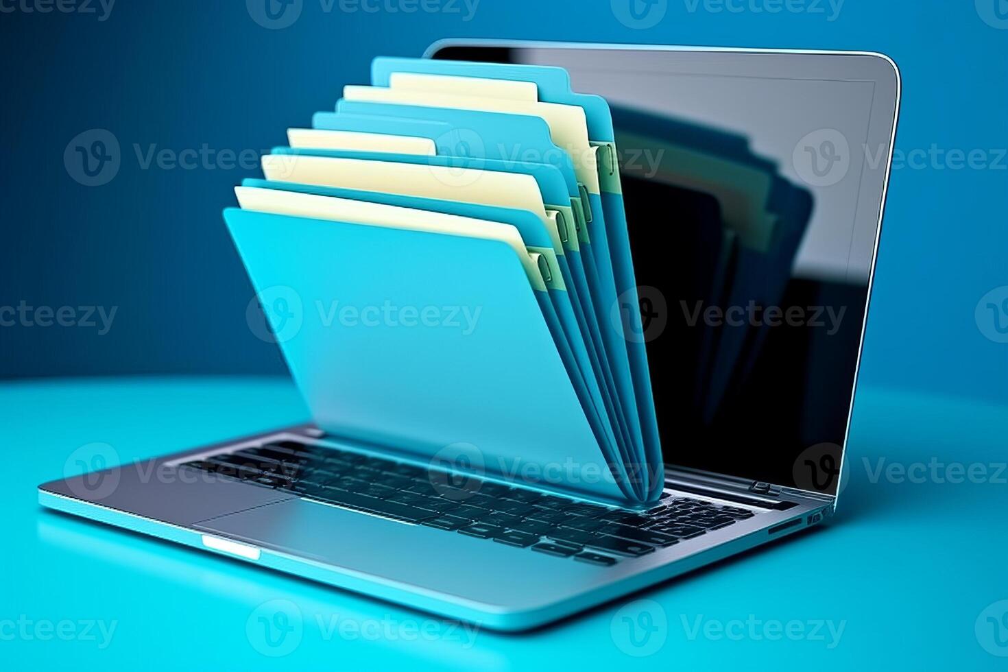 Laptop screen shows blue background with file folder, photo
