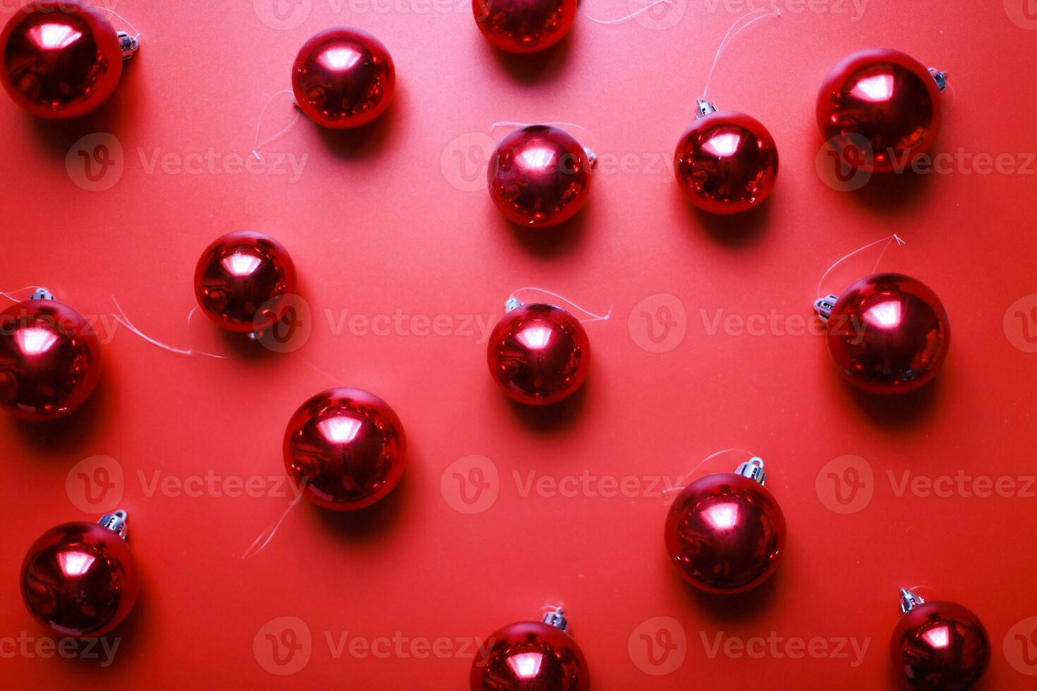 Flat lay balls for the Christmas tree on a red background. christmas background photo