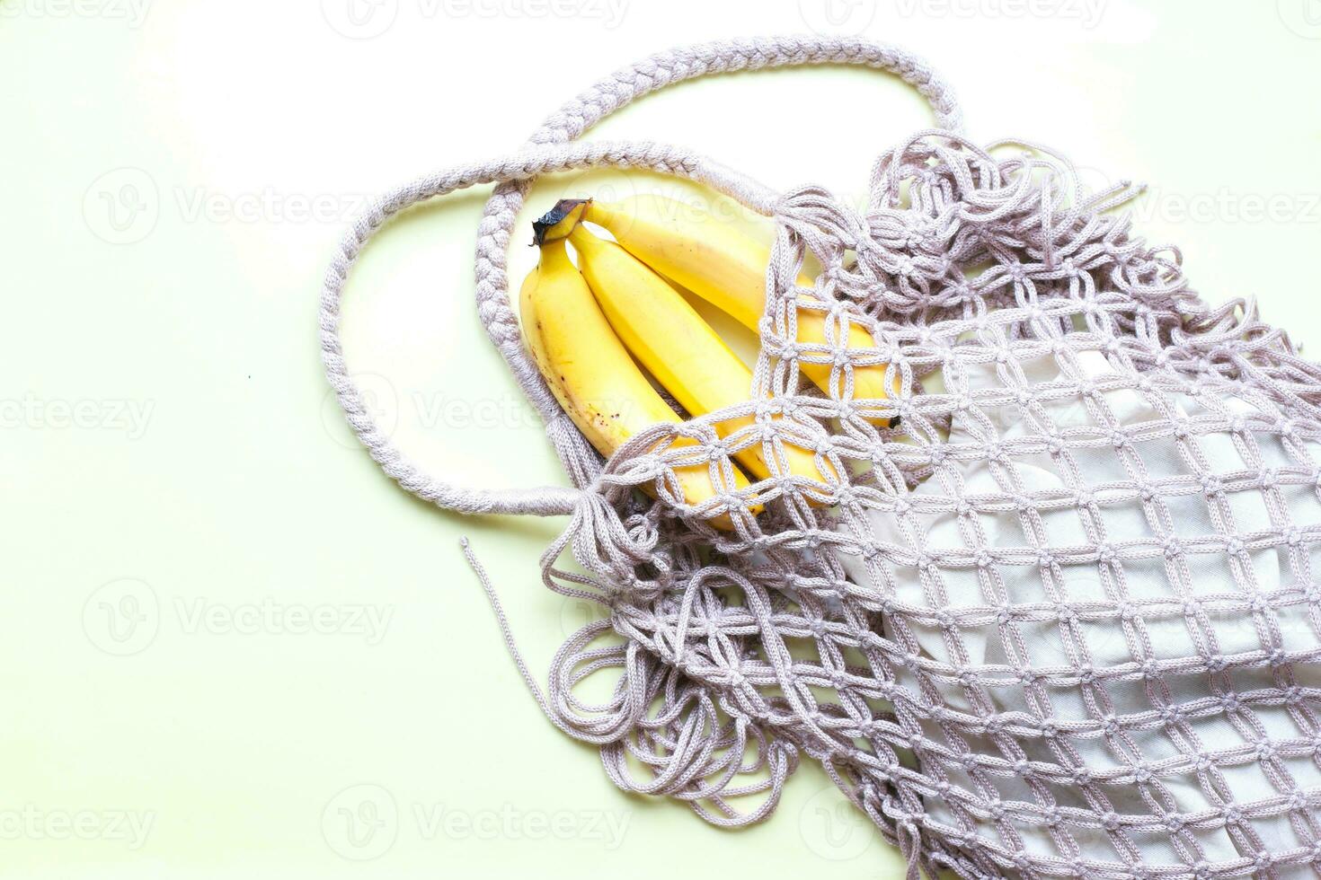 Flat lay ecology. Bananas in an eco bag.  Mesh bag photo
