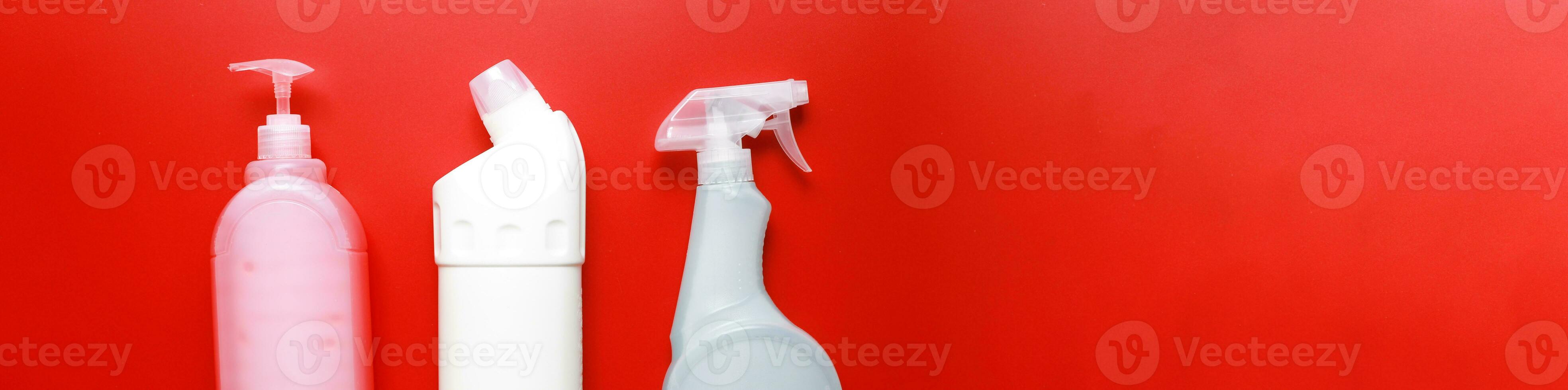 Banner Flat lay cleaning products on a red background. Cleaning bottle mockup photo