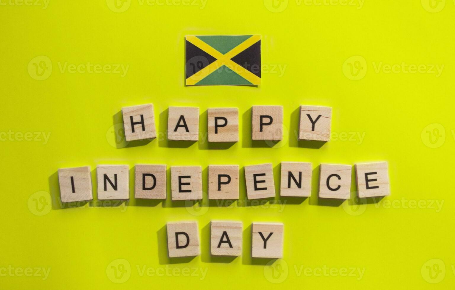 On August 6, Jamaica Independence Day, a minimalistic banner with the inscription in wooden letters happy Independence Day photo