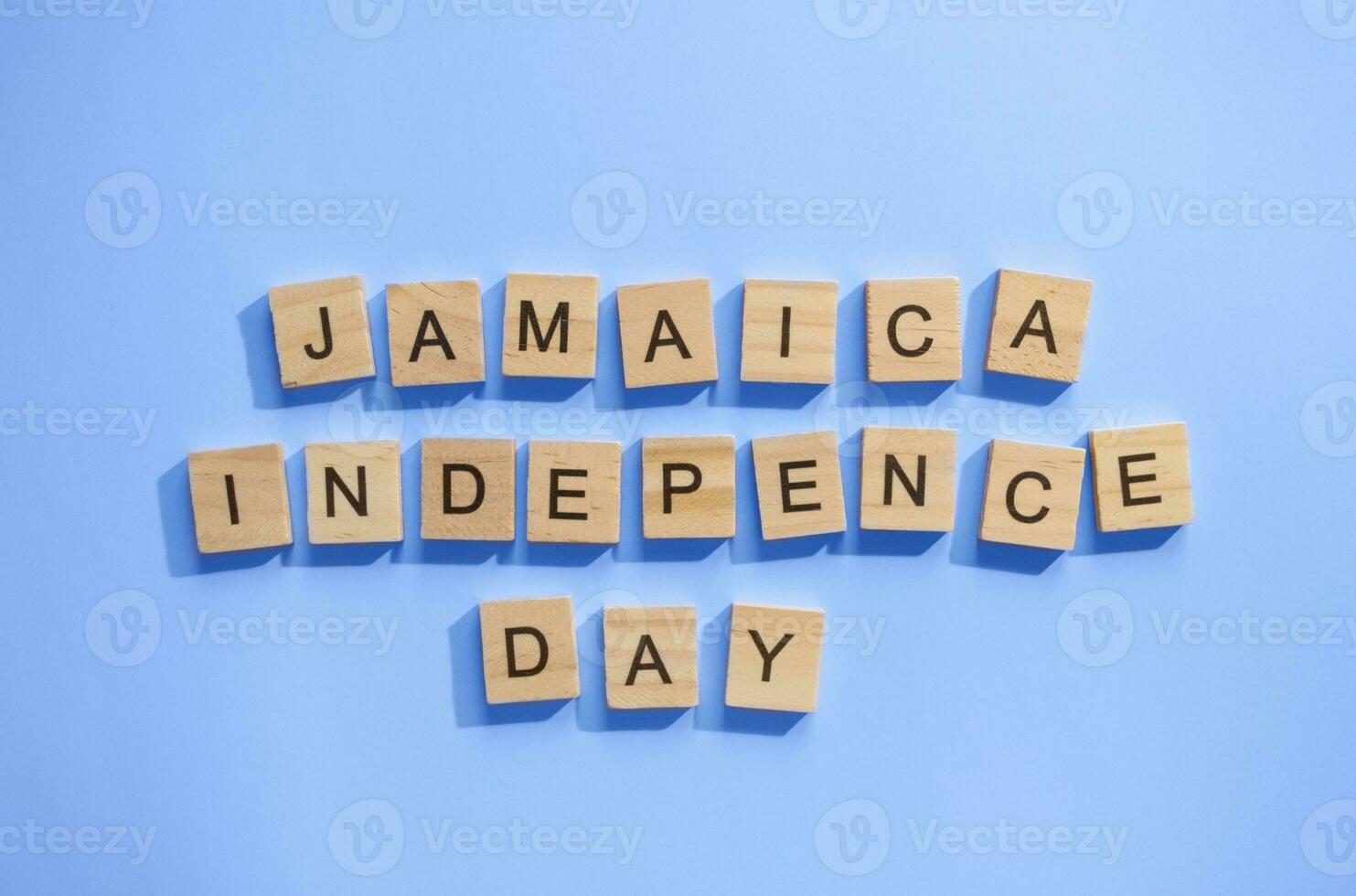 August 6, Jamaica Independence Day, flag of Jamaica, minimalistic banner with wooden letters photo