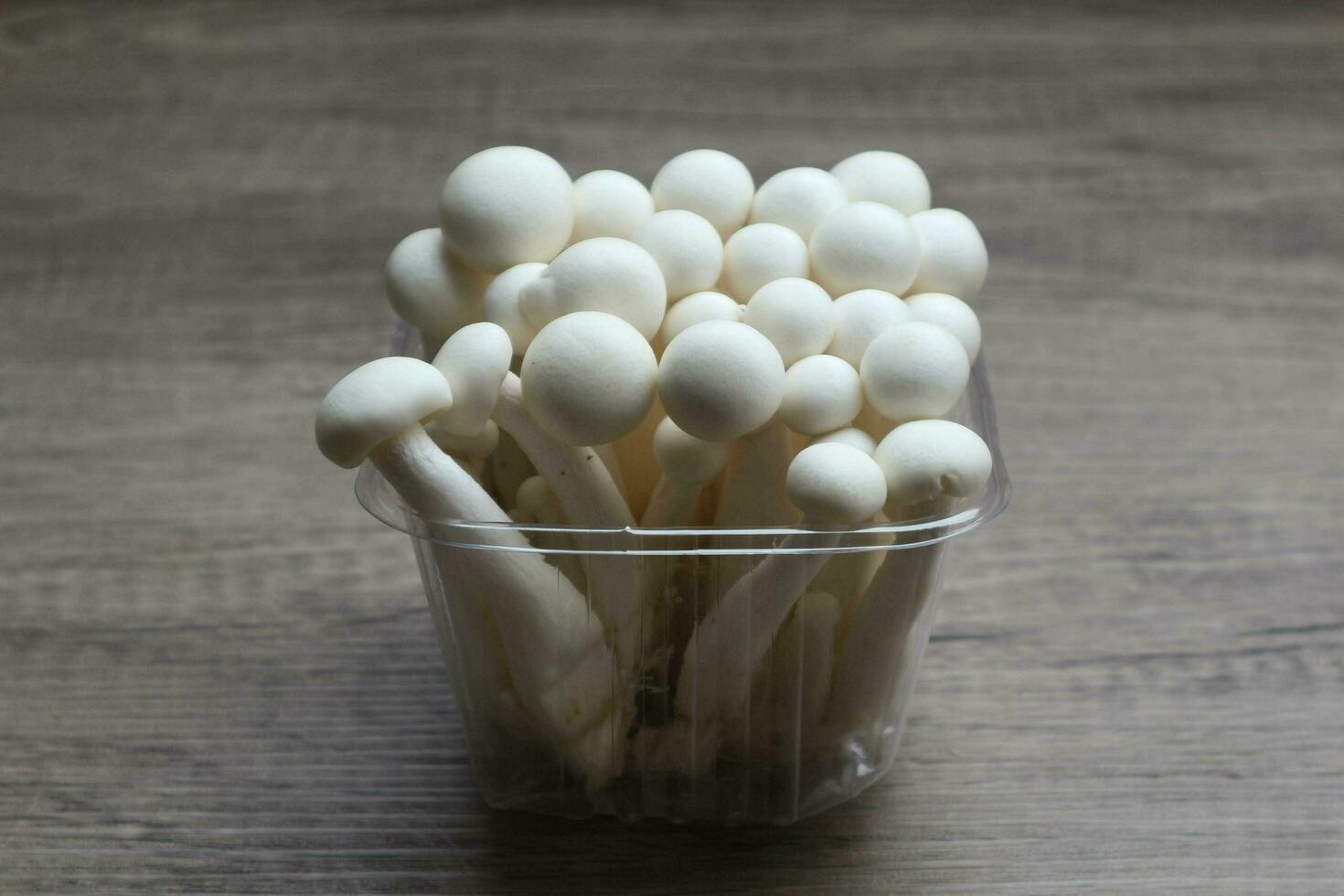 White beech mushrooms, Shimeji mushroom, Edible mushroom on the wooden table photo