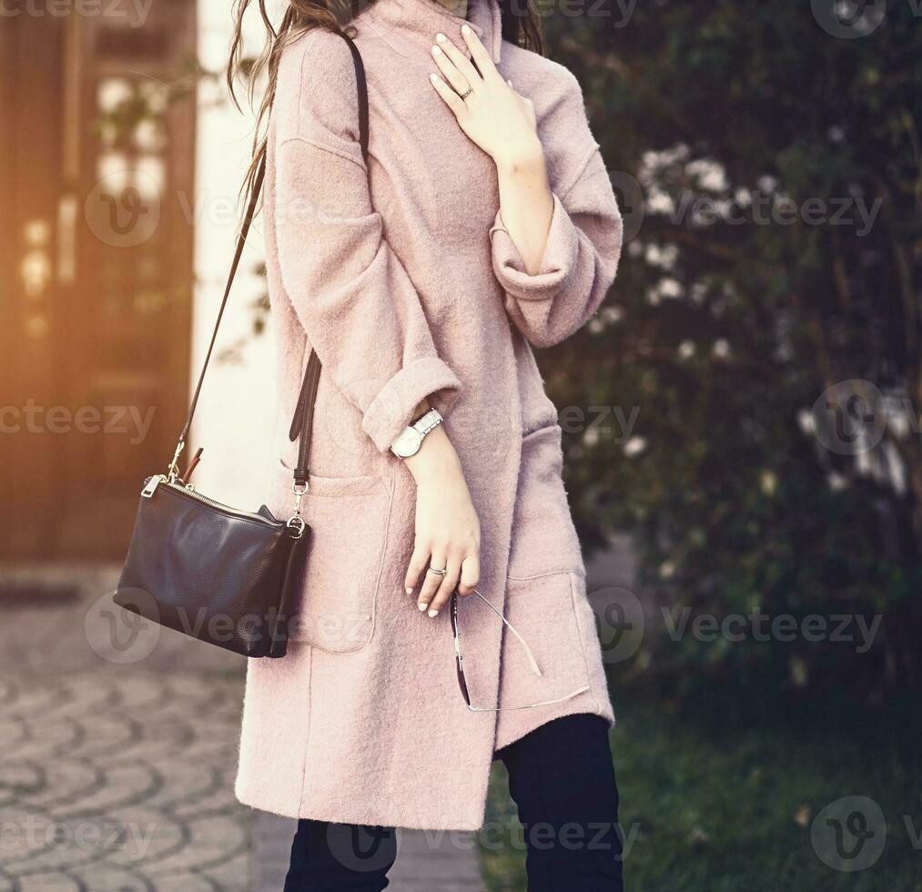 woman walking on street,wearing trendy coat photo