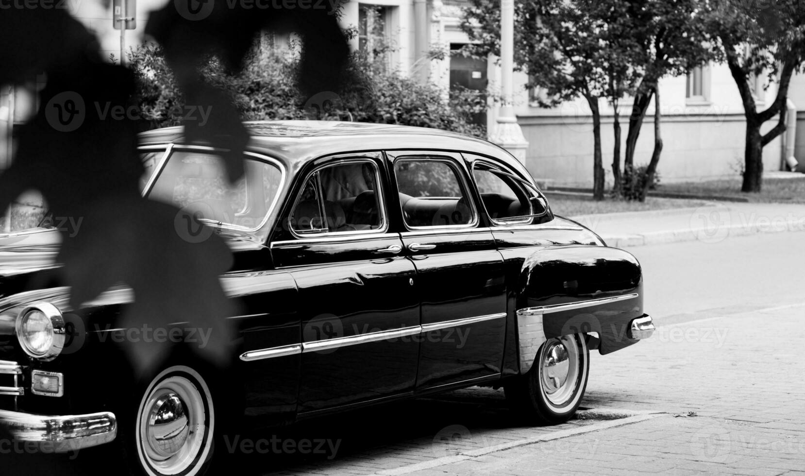 Black and white old-fashioned automobile. photo