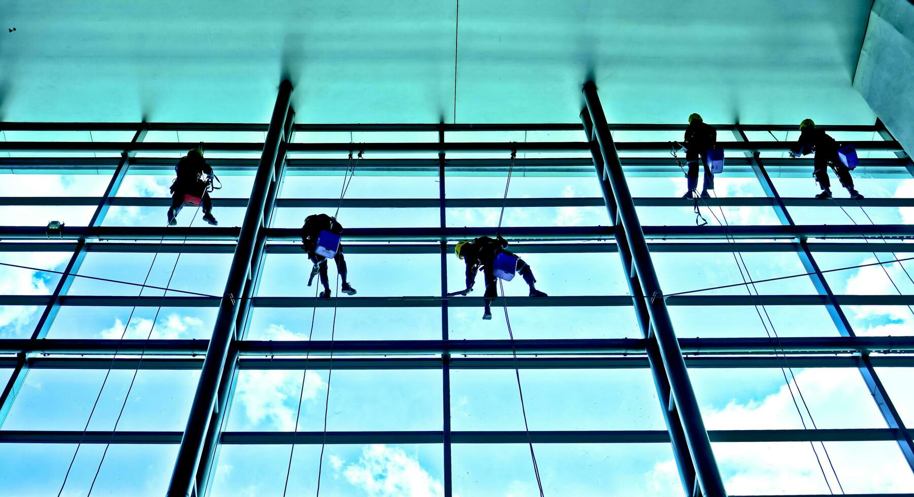 extreme work Cleaning the windows of buildings at height photo