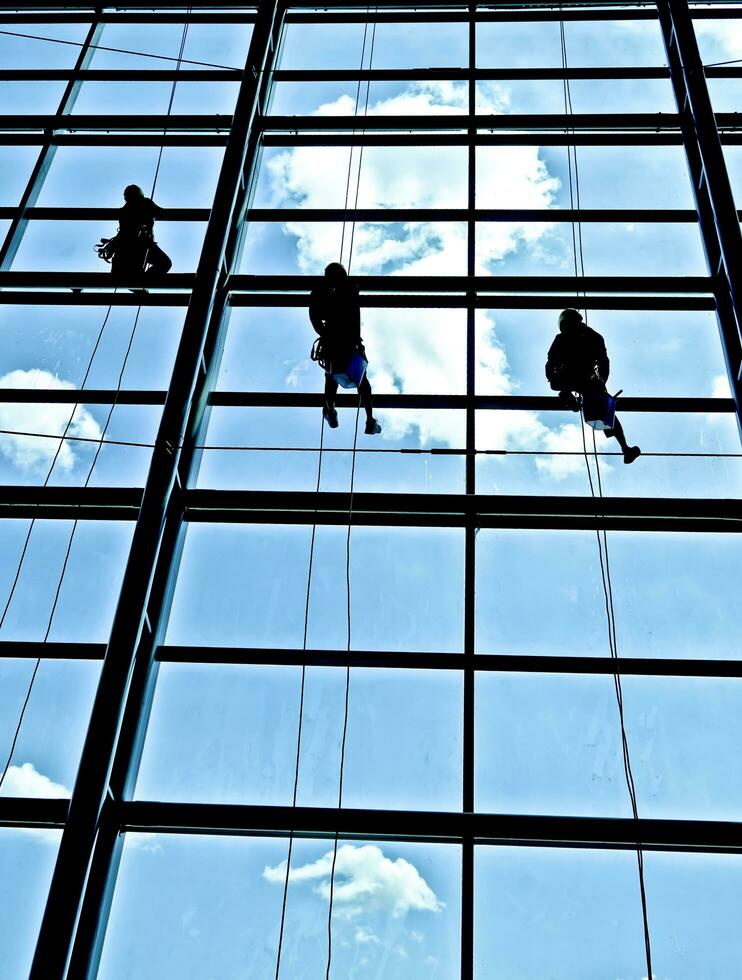 extreme work Cleaning the windows of buildings at height photo