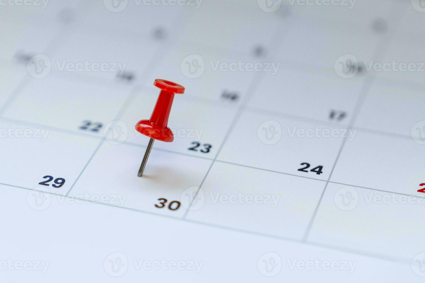 Red pin on calendar 30th day of the month photo