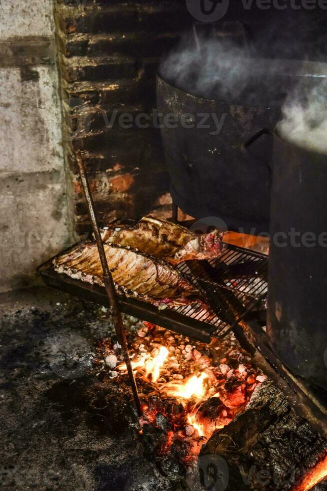 Pig ribbs barbecue , Patagonia, Argentina photo